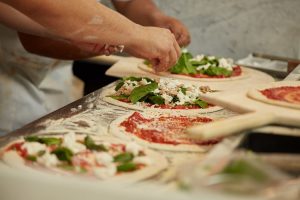 Pizza being prepared