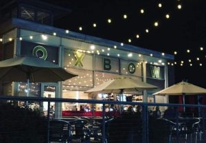 Exterior photo of the Oxbow Market at night